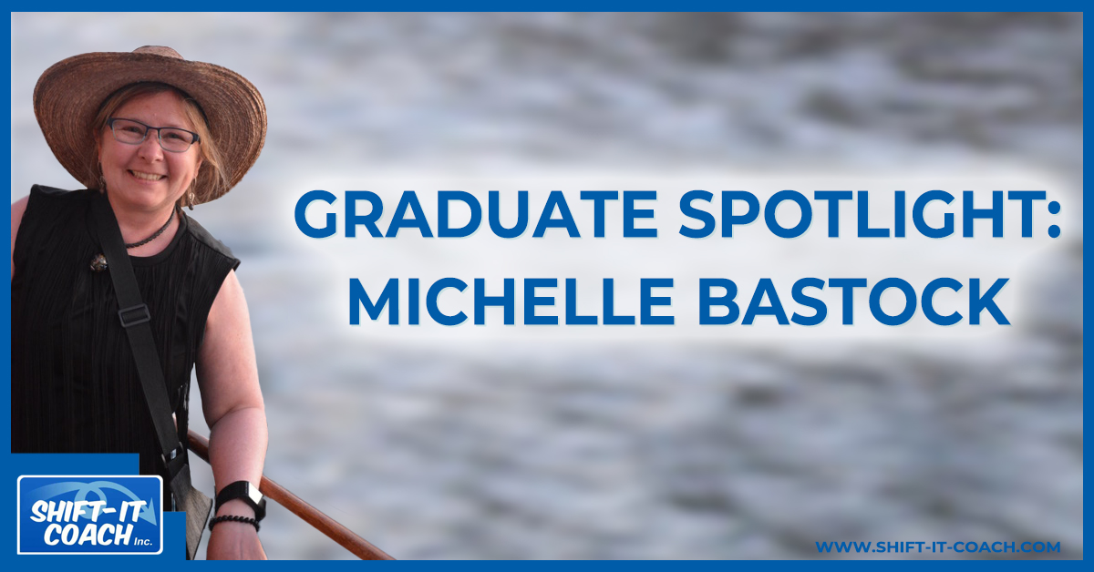 Visual coach graduate Michelle Bastock smiling at the camera with a large brimmed hat on, over the water.